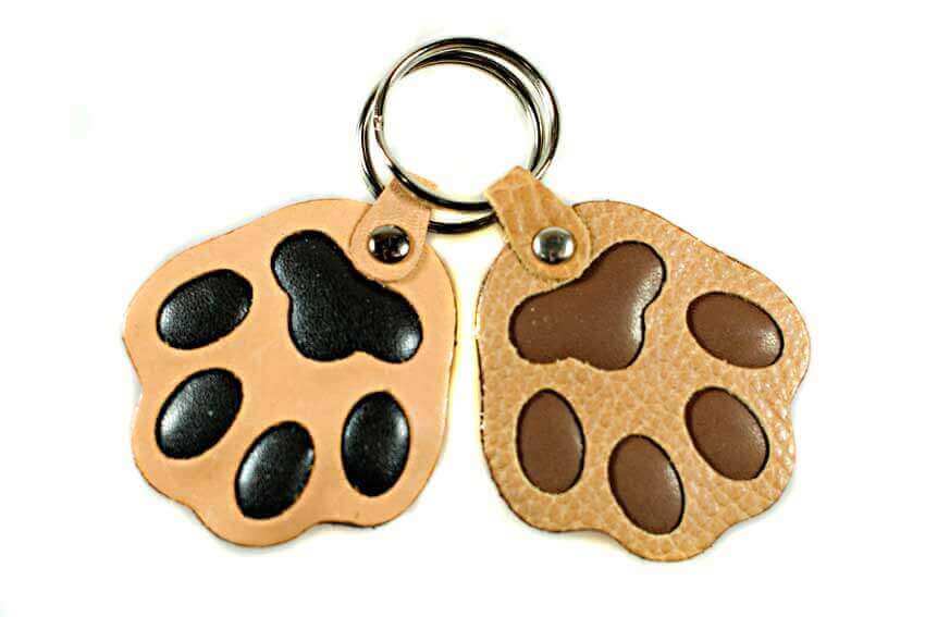 Beige and brown leather dog paw key rings