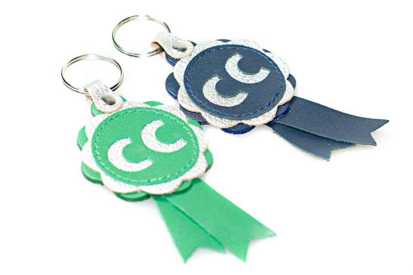 CC winner rosette key rings are available in blue and green with silver leather