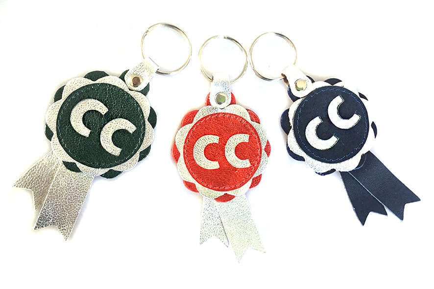 CC rosettes in red, green and blue with silver