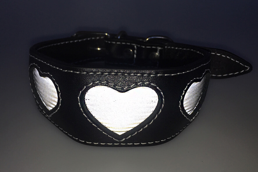 Silver reflective hearts hound collar in flashlight
